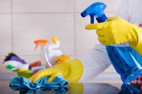 Cleaner preparing a service agreement for a UK cleaning booking